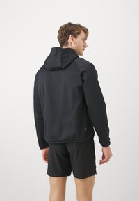 Nike Performance HOODIE - Jersey con capucha - black