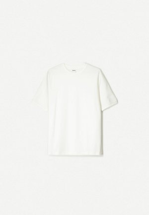 T-shirt bianco a maniche corte, realizzato in cotone morbido. Design a girocollo con una vestibilità comoda e senza loghi o motivi visibili.