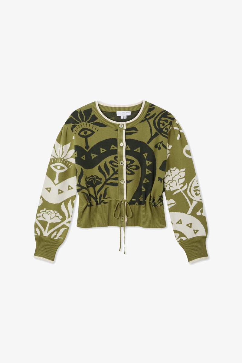 Zöld kötött kardigán, bonyolult növényi és szem mintákkal. Rövidített fazon, bordázott ujjal, kerek nyakkal és húzózsinóros derékkal.