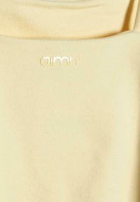 aim’n® Top - yellow