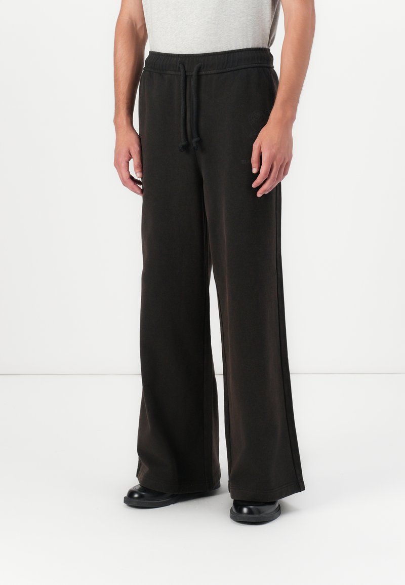 Marimekko PUUSKA VIHKIRUUSU PLACEMENT UNISEX - Tracksuit bottoms - dark brown
