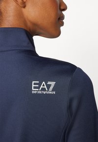 EA7 Emporio Armani GOLF PRO  - Běžecká bunda - blue