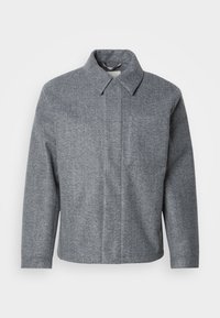 Grau, mit Fischgrätmuster versehene Jacke mit kragenförmigem Ausschnitt und langen Ärmeln. Verfügt über einen geraden Schnitt und ein sauberes, minimalistisches Design.