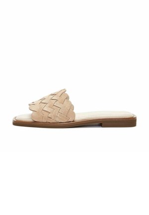 Beige suede slide sandal with woven upper design, flat sole, and light brown rubber base. Smooth footbed for comfort.