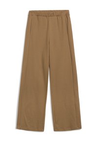 Pantalon large beige avec une taille élastique, featuring des poches latérales et une texture lisse et douce. Coupé à la cheville.