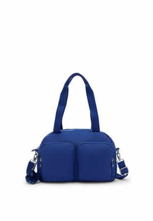 Blauwe nylon schoudertas met dubbele voorvakken met rits, twee handgrepen, verstelbare band en een kleine sleutelhanger aan de zijkant bevestigd.
