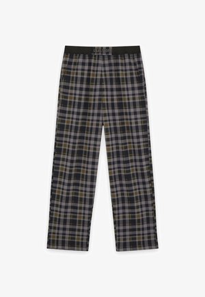 Pantalons lounge à carreaux dans des teintes sombres avec des accents verts et gris, dotés d'une taille élastique et d'une coupe décontractée. Fabriqués en tissu léger.