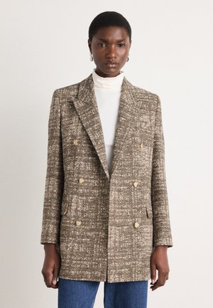 Double-breasted blazer in houndstooth pattern, made of textured brown and cream fabric, featuring gold-toned buttons and side pockets.