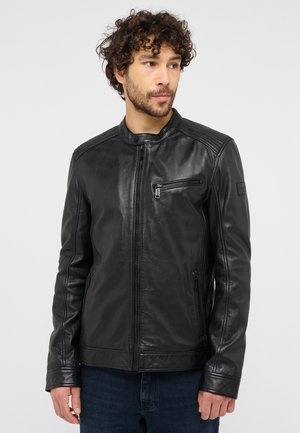 Black leather motorcycle jacket with a high collar, zippered pockets, and ribbed shoulder accents. Smooth texture, fitted design, and long sleeves.