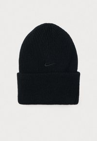 Crna rebrasta pletena kapa s preklopom i malim crnim Nike swoosh logotipom na prednjem centru.