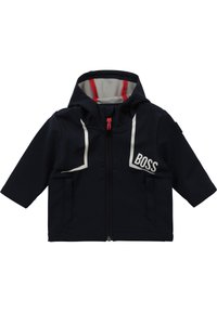Navy blue children's jacket with a hood, features red accents and a gray inner lining; white logo and zipper detailing on the front.