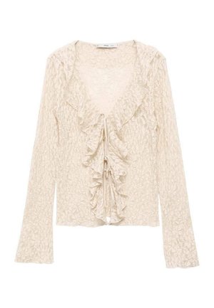Lys beige langærmet bluse med tekstureret ruffle foran, V-hals og snorelukning. Blødt, delikat stof med subtilt mønster.