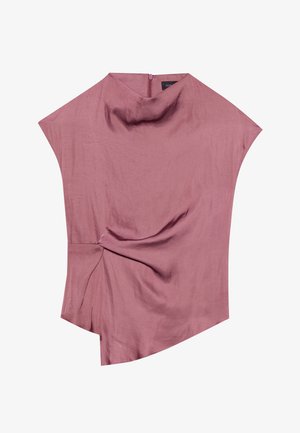 Blusa asimétrica en rosa empolvado, hecha de una tela ligera. Presenta un detalle retorcido en la cintura y un sutil escote alto con cremallera en la parte posterior.