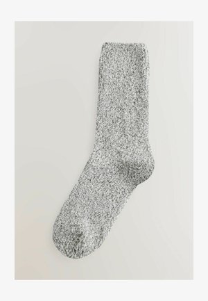Hallitud kootud sokk, millel on tekstureeritud, pehme välimus, ümar varvas ja klassikaline crew pikkuse disain.