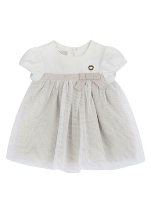 Abito bianco in cotone con maniche a sbuffo, cintura beige con fiocco e gonna in tulle con piccoli puntini argentati. Accento dorato a forma di cuore.