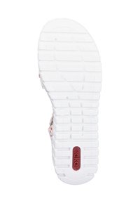 Semelle de chaussure en caoutchouc blanc avec des motifs de texture pour l'adhérence et un logo central rouge ; présente des crêtes et des indentations circulaires pour la traction.
