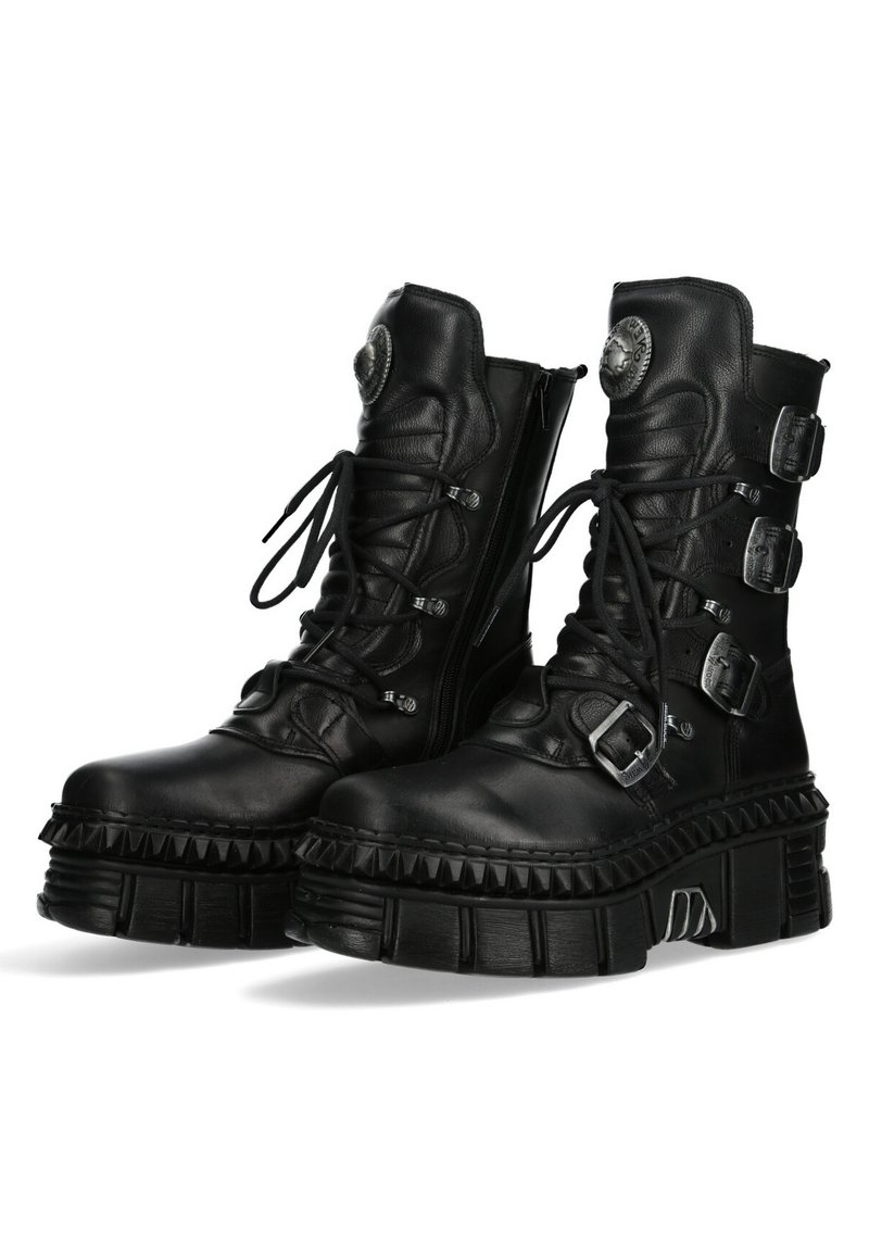 Black leather platform boots with lace-up front, three adjustable buckles, ribbed sole, and a textured finish. Rounded toe and side zipper.