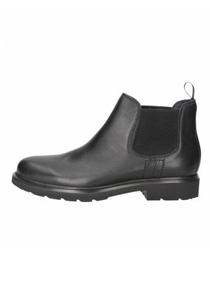 Botín Chelsea de cuero negro con paneles laterales elásticos, punta redonda, tacón bajo y suela de goma. Presenta costuras en contraste y una lengüeta.