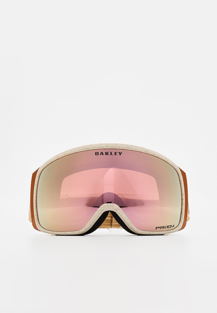 Oakley Schneebrillen mit rosa verspiegelten Gläsern, weißem Rahmen und braunen Akzenten. Texturiertes Band für sicheren Halt, mit "PRIZM"-Branding.