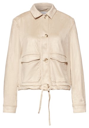 Beige nappitettava takki, jossa kaulus, kaksi etutaskua läpällä, pitkät hihat ja nyörisäätö helmassa.