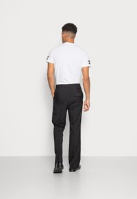 Weekday FRANKLIN FLARED TROUSERS - Calças - black