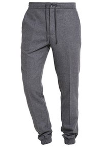 Gray jogger pants with button and drawstring waist, elastic cuffs, and side pockets.