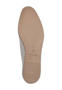 Shoe sole with a smooth beige finish, featuring a textured grip pattern, a subtle logo, and a rounded shape at the toe.