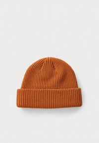 Orange knitted beanie with folded brim, displayed on a white background.