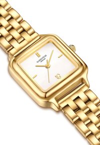 Kuldne metallist randmekell ruudukujulise valge dials, kuldsed käed ja mustriga lingirihm. Omab krooni paremal küljel.