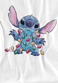 Character design of a blue creature wrapped in colorful holiday lights, with large ears and eyes, set against a white background.