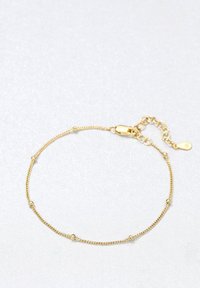 Pulsera de cadena de oro con un diseño delicado que presenta pequeñas cuentas redondas espaciadas uniformemente a lo largo de la longitud y un cierre de langosta.