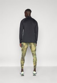 Nike Performance CAMO  - Leggings - oil green/medium olive/black