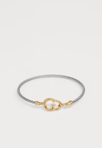 Silver cable-style bracelet with gold-tone clasp featuring a 'G' logo, smooth texture, and subtle detailing along the edges.