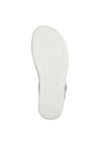 Sole in gomma bianca con un motivo testurizzato per una presa migliore, caratterizzata da linee ondulate e un logo circolare vicino al tallone.