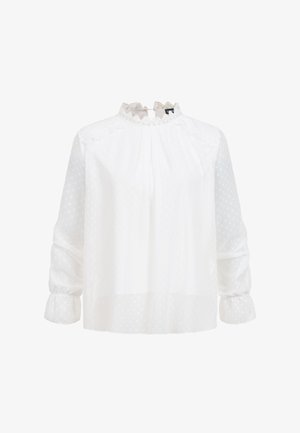 Valkoinen pitkähiha pusero, jossa on läpikuultava pilkullinen kangas, pitsinen korkea kaulus, olkapäiden pitstripitsi ja kerätyt hihansuut.