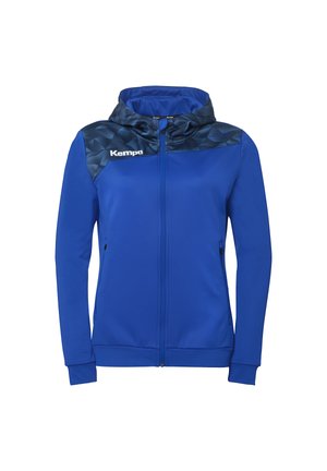 Veste à capuche bleue avec fermeture éclair, panneau d'épaule à motifs plus foncés et logo blanc "Kempa" sur la poitrine.