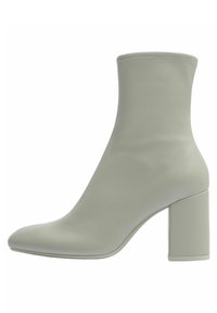 Jasnozielony botek za kostkę z wydłużonym noskiem i słupkiem. Posiada gładki materiał oraz elastyczne wykończenie górnej krawędzi, zapewniające dopasowanie.