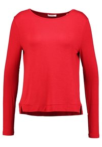 Rotes Langarmshirt aus glattem Stoff, mit rundem Halsausschnitt, seitlichen Schlitzen und lockerer Passform.