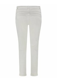 White denim pants with a slim fit, featuring back pockets, stitched detailing, and rolled cuffs at the ankles. Smooth texture.