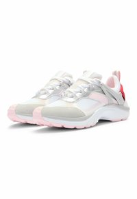 White and pink athletic shoes with mesh and suede materials, a rounded shape, and textured pink rubber soles. Features reflective laces and accents.