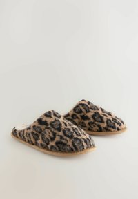 Leopard print slippers with a soft fur exterior, beige and black color scheme, and a rounded toe design. Flat, lightweight sole for comfort.