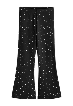 Schwarze ausgestellte Hose mit elastischem Bund, verziert mit einem verstreuten weißen Sternenmuster auf dem Stoff.