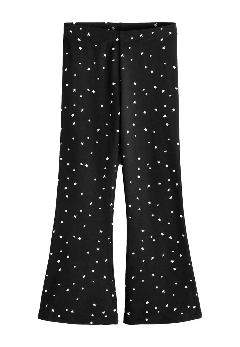 Pantalon évasé noir avec une taille élastique, décoré d'un motif d'étoiles blanches dispersées sur le tissu.