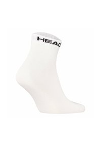 Chaussette blanche de cheville en mélange de coton, dotée d'un haut à côtes et d'un bandeau noir avec le logo "HEAD". Texture lisse, forme ajustée.