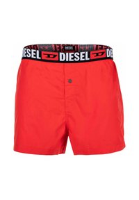 Rode zwemshorts met een zwarte tailleband met witte "DIESEL" logo. Gemaakt van lichtgewicht stof, met een knoopsluiting aan de voorkant.