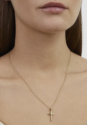 Goldene Halskette mit kleinem Kreuzanhänger. Die Kette besteht aus einem zarten, verknüpften Design. Der Anhänger hat eine polierte, reflektierende Oberfläche.