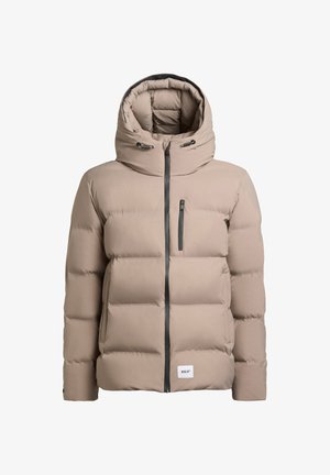 Beige puffjacka med huva, har en framzipning, elastiska detaljer och en bröstficka. Tillverkad av vadderat, isolerat material.