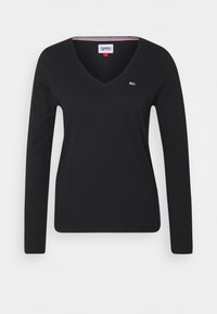 Svart långärmad V-ringad t-shirt i mjuk bomull, med en liten logotyp på bröstet och kontrasterande rand inuti halsringningen.