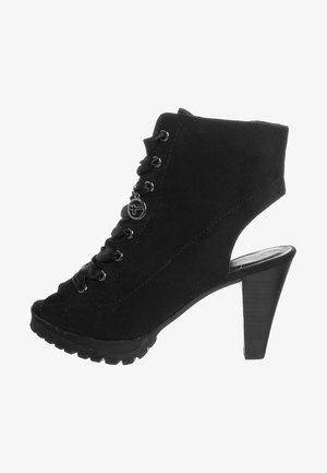 Black ankle boot with a high heel, suede texture, lace-up front, and open back. Features grooved sole for traction.