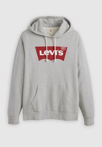 Felpa grigia realizzata in tessuto morbido con tasca a marsupio frontale, caratterizzata da un grande logo rosso di Levi's sul petto e cordini sul cappuccio.